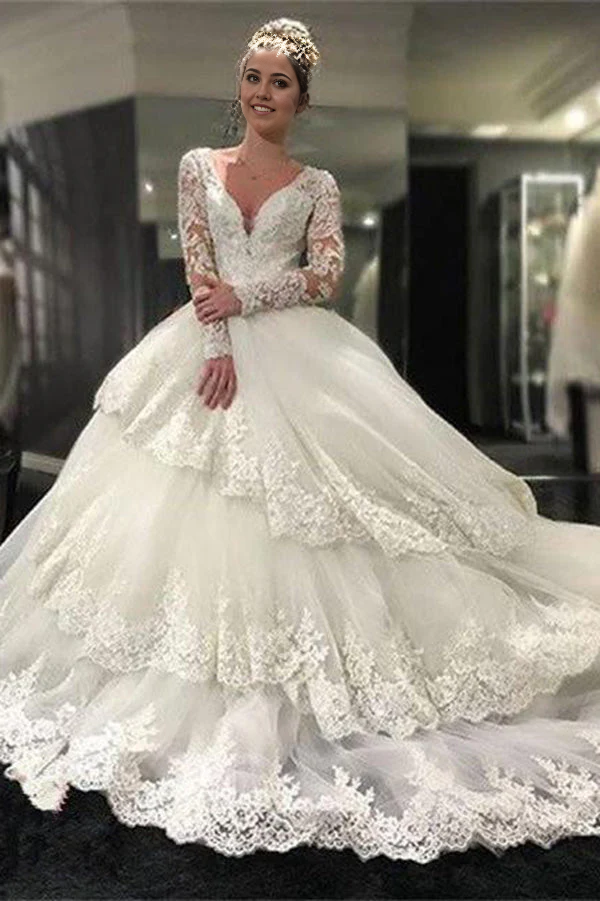 Hermosos vestidos de novia de corte A con escote en V profundo, mangas largas y apliques de encaje 