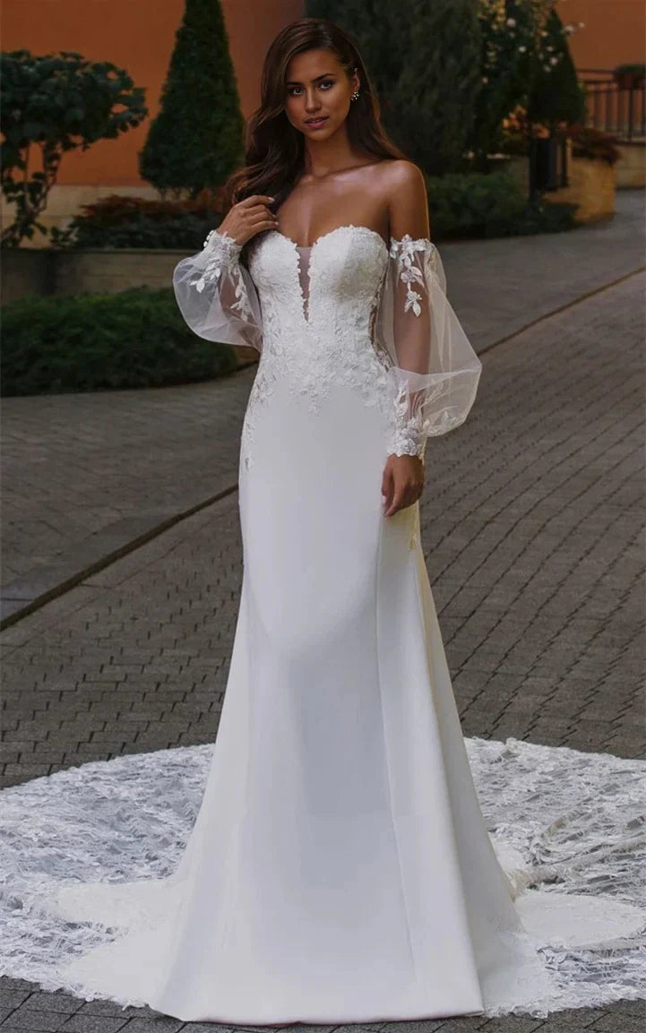 Vestido de novia de tul y gasa con escote pronunciado y apliques de sirena