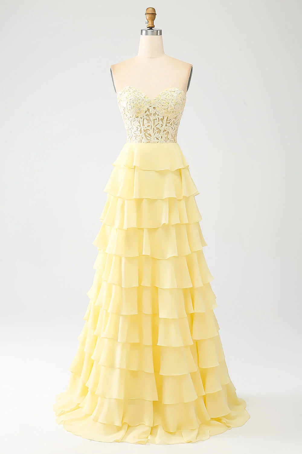 Vestido de fiesta amarillo con escote en forma de corazón y capas