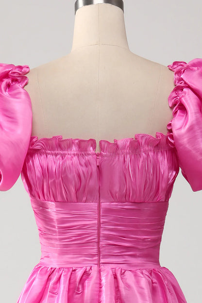 Vestido de fiesta rosa intenso con mangas abullonadas y volantes