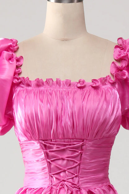 Vestido de fiesta rosa intenso con mangas abullonadas y volantes