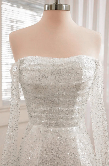 Vestido de novia de manga larga con lentejuelas y espalda descubierta