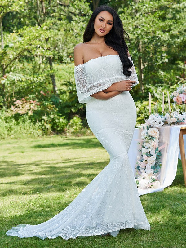 Vestidos de novia de corte trompeta/sirena con volantes, sin tirantes, sin mangas y con cola larga